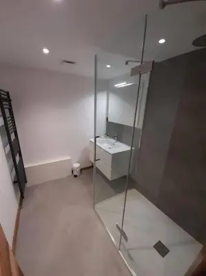 a bathroom with a glass shower and a sink at Chalet Claudia by Brennus Chamonix in Chamonix-Mont-Blanc