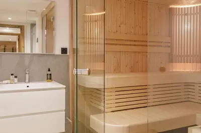 a bathroom with a shower and a sink at Chalet Claudia by Brennus Chamonix in Chamonix-Mont-Blanc