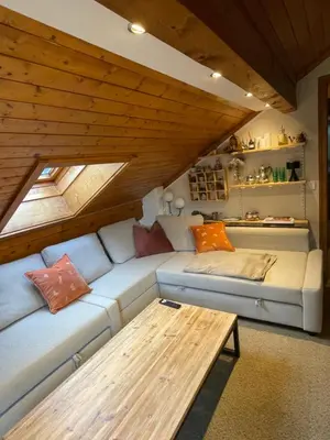 a living room with a couch and a table at Appartement 6 personnes les Contamines Montjoie in Les Contamines-Montjoie