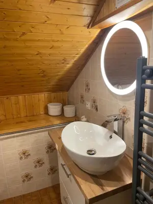 a bathroom with a white sink and a mirror at Appartement 6 personnes les Contamines Montjoie in Les Contamines-Montjoie