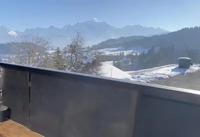a balcony with a view of a snow covered mountain at Studio lumineux avec vue sur le Mont Blanc in Cordon