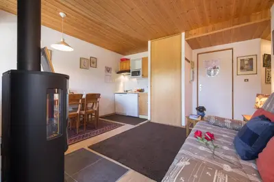 a bedroom with a bed in a room at Résidence Igloo 3 ski in-ski out - Happy Rentals in Le Tour