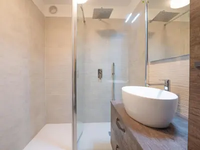 a bathroom with a sink and a shower at Apartment Champraz-17 by Interhome in Chamonix-Mont-Blanc