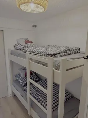 a room with a bunk bed on a shelf at Les Airelles 406 in Les Carroz d'Araches