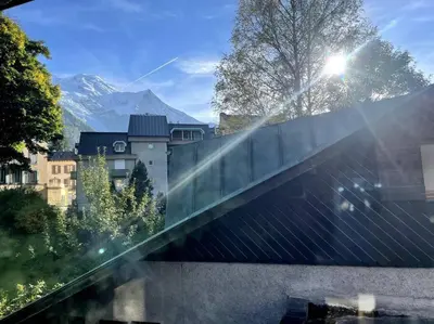 a glass bridge with a mountain in the background at Cosy appartement centre chamonix in Chamonix-Mont-Blanc