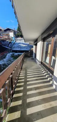 a walkway outside of a building next to the water at Résidence La Cry - Appartement 3 pièces - 6 personnes Vue Mont-Blanc MAE-5604 in Combloux