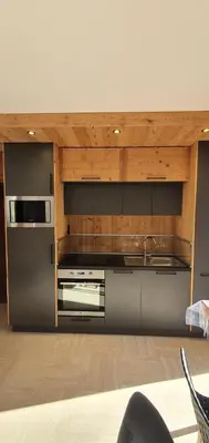a kitchen with a stainless steel refrigerator and a microwave at Résidence La Cry - Appartement 3 pièces - 6 personnes Vue Mont-Blanc MAE-5604 in Combloux