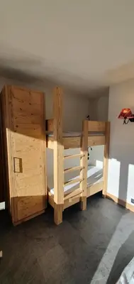 a wooden bunk bed in a room at Résidence La Cry - Appartement 3 pièces - 6 personnes Vue Mont-Blanc MAE-5604 in Combloux