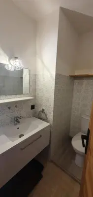 a bathroom with a white sink and a toilet at Résidence La Cry - Appartement 3 pièces - 6 personnes Vue Mont-Blanc MAE-5604 in Combloux
