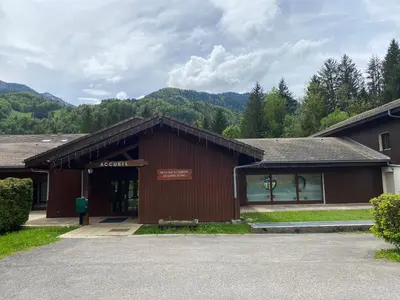 a building with a sign on the front of it at Apt Sakura - Le Grand Tetras in Samoëns