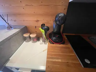 a kitchen counter with a blender and cups on it at LOUE STUDIO MEGEVE in Megève