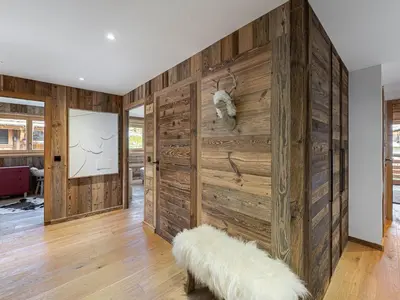 a wooden deck with a view of the mountains at Appartement lumineux de 100 m² avec balcon, proche centre Megève, 4 adultes et 2 enfants - FR-1-569-87 in Megève