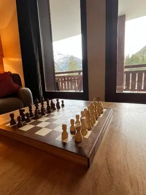 a chess board is sitting on the floor in a room at French Alps Luxury in Vallorcine