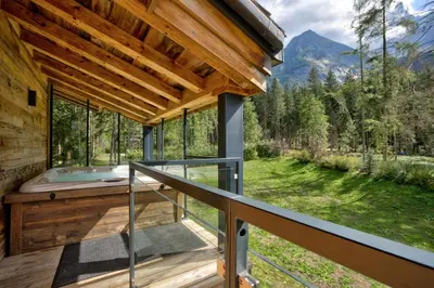 a house in the mountains with a hot tub at Black Pearl in Chamonix-Mont-Blanc