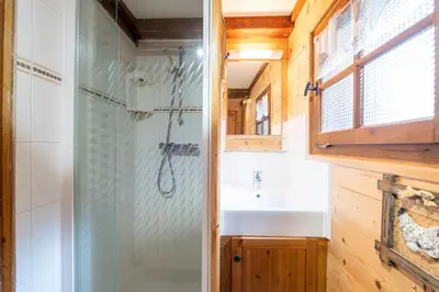 a bathroom with a shower and a sink at Chalet du Brey - Avec terrasse et jardin in Saint-Gervais-les-Bains
