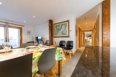 a dining room with a table and chairs at Grand Paradis B01 - Modern with great location in Chamonix-Mont-Blanc