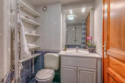 a bathroom with a toilet and a sink at Appartement Belle Epoque - Happy Rentals in Chamonix-Mont-Blanc