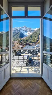an open window with a view of a mountain view at Majestic T2 calme, spacieux, central, avec parking in Chamonix-Mont-Blanc