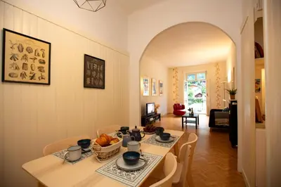 a dining room with a table and chairs at Majestic T2 calme, spacieux, central, avec parking in Chamonix-Mont-Blanc