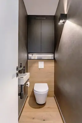 a small bathroom with a toilet and a sink at Mont-Blanc View - Panoramic Balcony - Chamonix Centre in Chamonix-Mont-Blanc