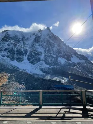 a snow covered mountain with a bench in front of it at Mont-Blanc View - Panoramic Balcony - Chamonix Centre in Chamonix-Mont-Blanc