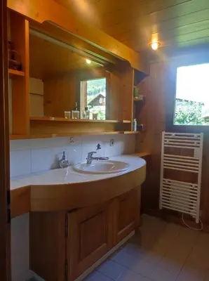 a bathroom with a sink and a window at TellaHouse in Chamonix-Mont-Blanc