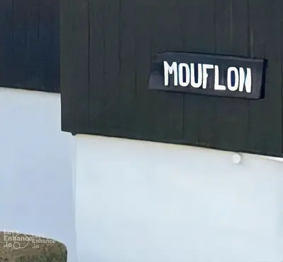 a black and white building with a window at Adorable studio, proche pistes de ski, à Combloux in Combloux