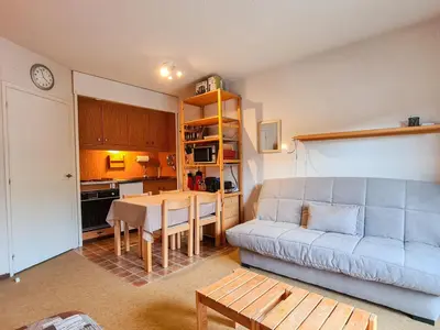 a living room with a couch and a table at Studio confortable, balcon sud, proche pistes, casier à ski - FR-1-425-203 in Arâches-la-Frasse