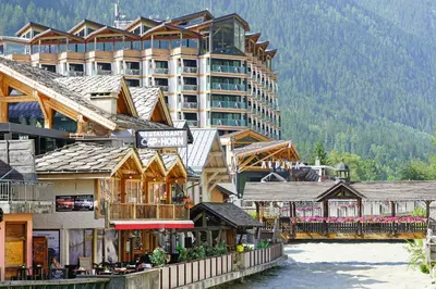 a ski lift in the mountains with people on it at Chamonix Sud - Bâtiment C 121 - Happy Rentals in Chamonix-Mont-Blanc