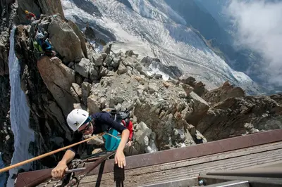 a ski lift going down a snow covered mountain at Chamonix Sud - Bâtiment C 121 - Happy Rentals in Chamonix-Mont-Blanc