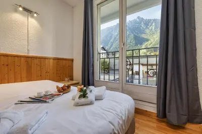 a bedroom with two bunk beds in a room at Chamonix Sud - Bâtiment C 121 - Happy Rentals in Chamonix-Mont-Blanc