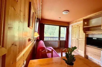 a dining room with a table and a window at Second de Cordée in Combloux