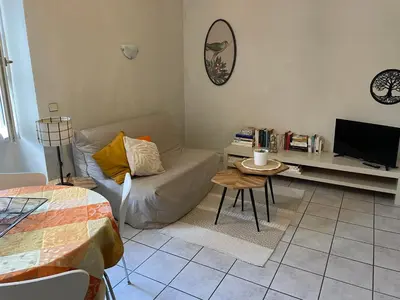 a living room with a couch and a table at Le Mont Joly & Les 4 Têtes in Sallanches