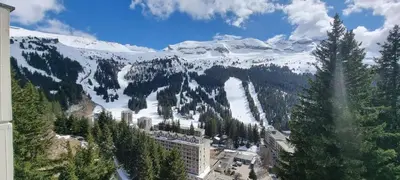 a bedroom with a bed with a mountain view at La spatule in Flaine