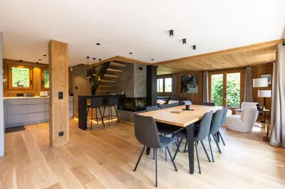a dining room and kitchen with a table and chairs at Megève - Chalet Miage in Demi-Quartier