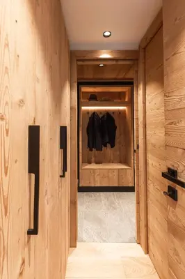 a room with a closet with wooden walls at Megève - Chalet Miage in Demi-Quartier