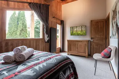a bedroom with a bed and a window at Megève - Chalet Miage in Demi-Quartier