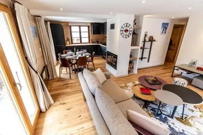 a living room with a couch and a table at Megeve centre ville in Megève