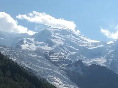 a mountain with snow on top of it at Lyret - Centre ville, vue MontBlanc, parking, wifi in Chamonix-Mont-Blanc