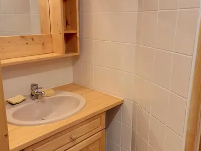 a bathroom with a sink and a mirror at Studio confortable · 4 personnes · Flaine Centre · Terrasse - FR-1-425-204 in Arâches-la-Frasse