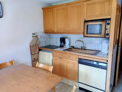 a small kitchen with a sink and a microwave at Studio confortable · 4 personnes · Flaine Centre · Terrasse - FR-1-425-204 in Arâches-la-Frasse