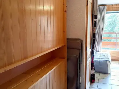 a room with wood paneling and a room with a window at Studio confortable · 4 personnes · Flaine Centre · Terrasse - FR-1-425-204 in Arâches-la-Frasse