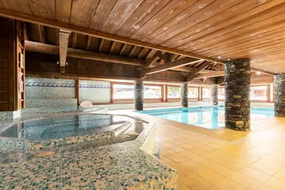a large swimming pool with a swimming pool at Résidence Les Fermes du Soleil - maeva Home - Appartement 3 Pièces 6 Personnes - Sélection MAE-6505 in Les Carroz d'Araches