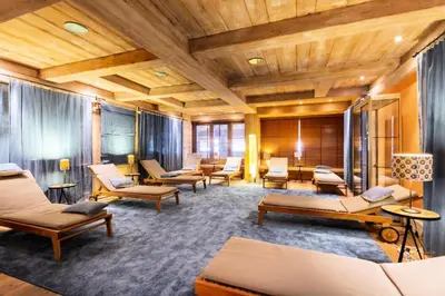 a room with a bunch of chairs and tables at Résidence Les Fermes du Soleil - maeva Home - Appartement 3 Pièces 6 Personnes - Sélection MAE-6505 in Les Carroz d'Araches