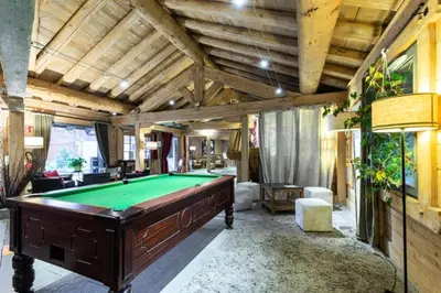 a large room with a pool table in it at Résidence Les Fermes du Soleil - maeva Home - Appartement 3 Pièces 6 Personnes - Sélection MAE-6505 in Les Carroz d'Araches