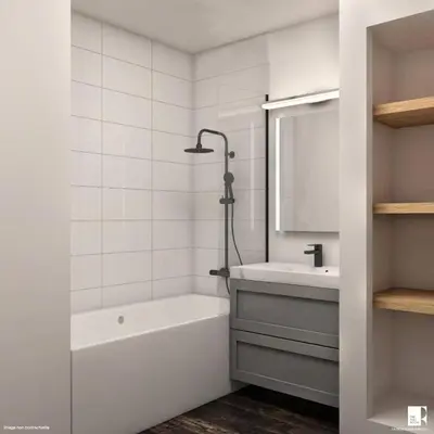 a white bathroom with a tub and a sink at Résidence La Rivière - maeva Home - Appartement 2 pièces 6 personnes - Sélection MAE-8671 in Chamonix-Mont-Blanc