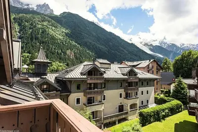 a view from a balcony of a town with mountains at Résidence La Ginabelle - maeva Home - Appartement 2 Pièces 4 Personnes - Sélection MAE-9584 in Chamonix-Mont-Blanc
