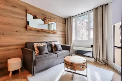 a living room with a couch and a table at L'Aiguille - maeva Home - Appartement 2 pièces 4 personnes Exclusive MAE-1386 in Chamonix-Mont-Blanc