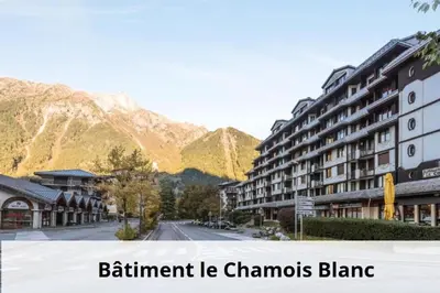 a street in a town with mountains in the background at L'Aiguille - maeva Home - Appartement 2 pièces 4 personnes Exclusive MAE-1386 in Chamonix-Mont-Blanc