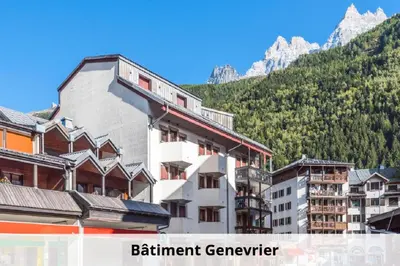 a group of buildings in front of a mountain at L'Aiguille - maeva Home - Appartement 2 pièces 4 personnes Exclusive MAE-1386 in Chamonix-Mont-Blanc